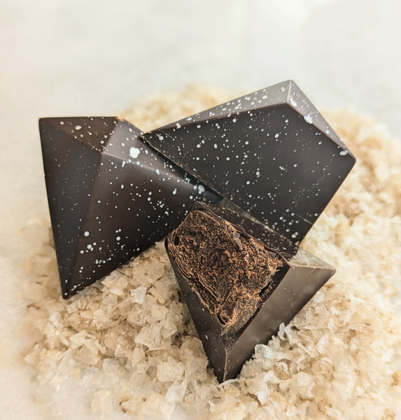 Dark chocolate truffles on a bed of sea salt crystals