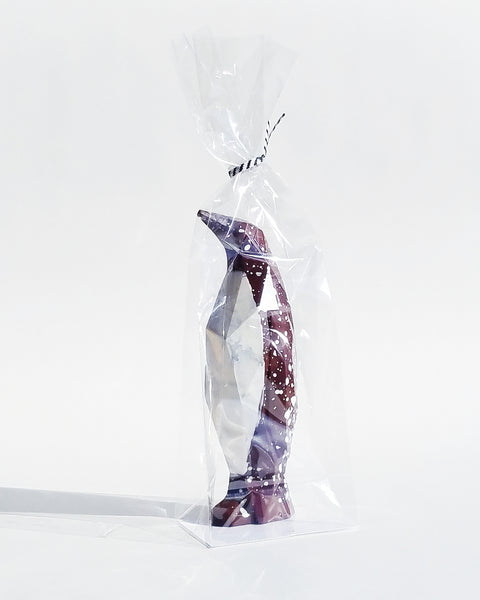 Chocolate Peppermint Penguin in cellophane bag on a white background